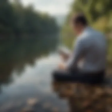 A tranquil scene featuring a person reflecting on a self-help book beside a calm body of water.