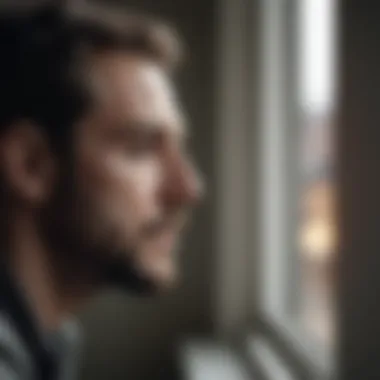 Reflections on Betrayal A man deep in thought while looking out a window