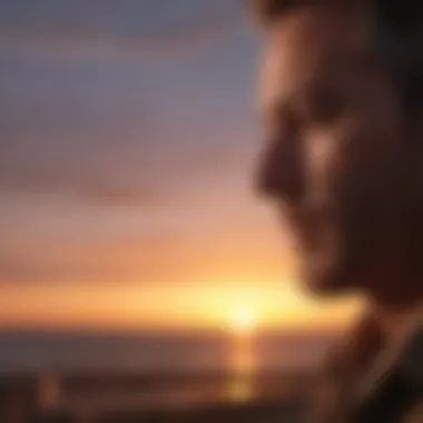 A man reflecting on his feelings during a sunset