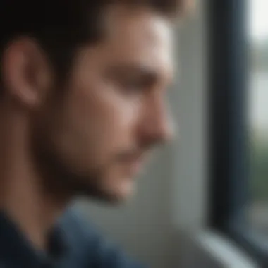 A person gazing thoughtfully out a window, reflecting on trust