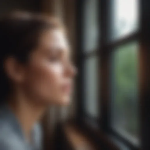 Woman staring out of the window with a distant look